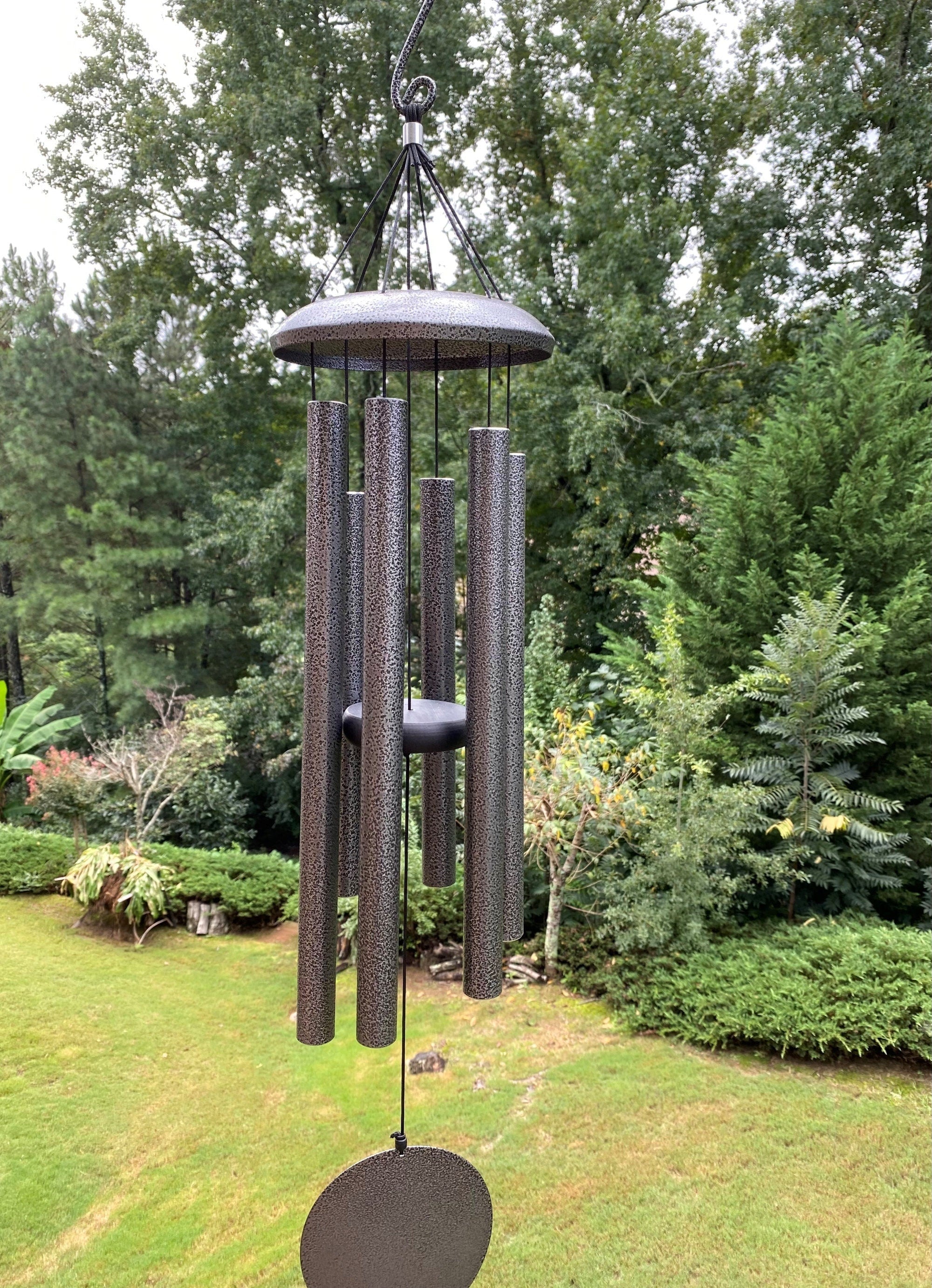 Wind chimes with long metal tubes for a deep tone, perfect for memorials