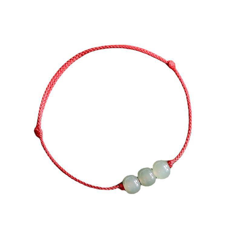 Bracelet porte-bonheur en jade à trois perles tissées