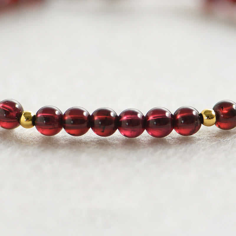 Bracelet de stabilité en perles dorées et grenat naturel
