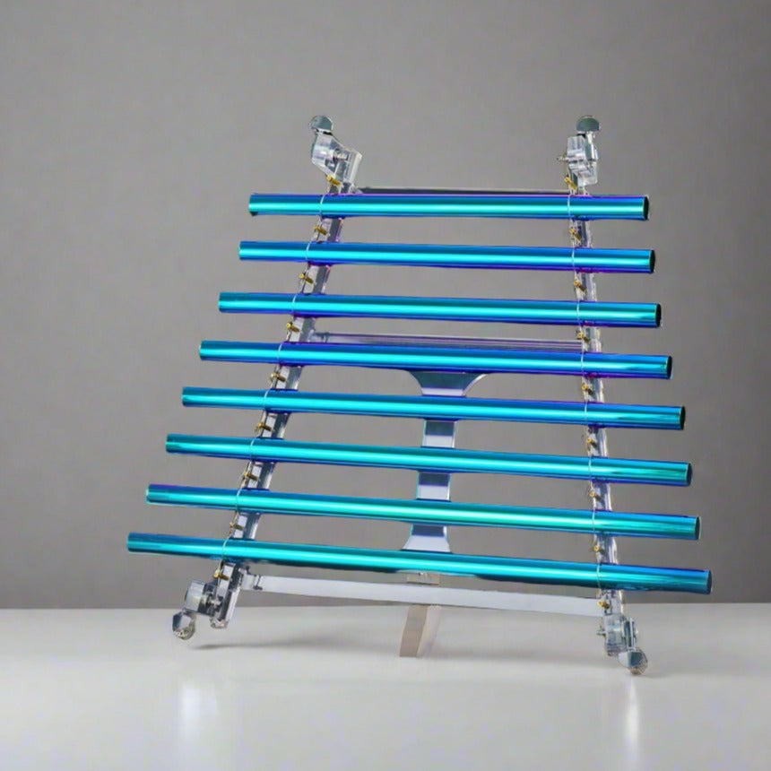 Turquoise and blue neon light tubes on a crystal singing harp with an alumina box