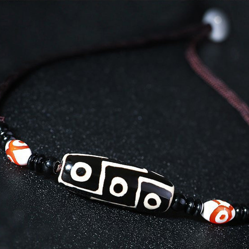 Collier unisexe en perles dzi à neuf yeux | Protection en agate
