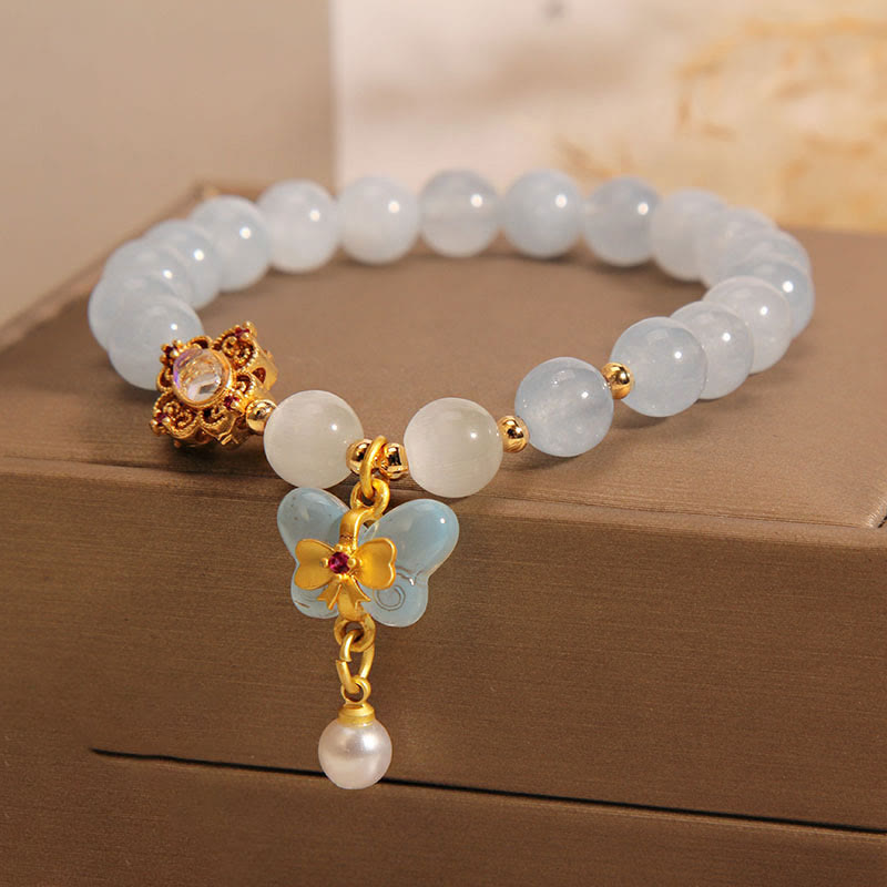 Bracelet aigue-marine avec œil de chat et perle papillon pour la guérison