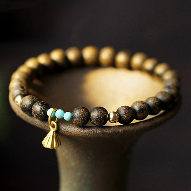 Bracelet de force en bois d'agar et lotus pour l'équilibre et le calme