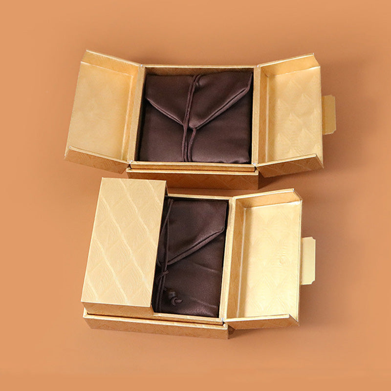 Coffret à bijoux zen doré à motif plumes