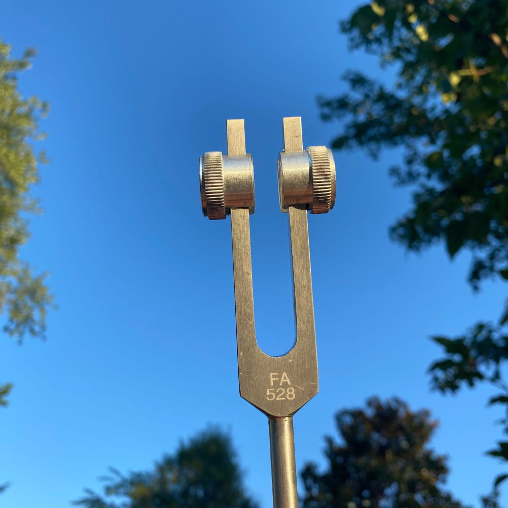Metal tuning fork with adjustment screws for 528 Hz vibrational healing therapy