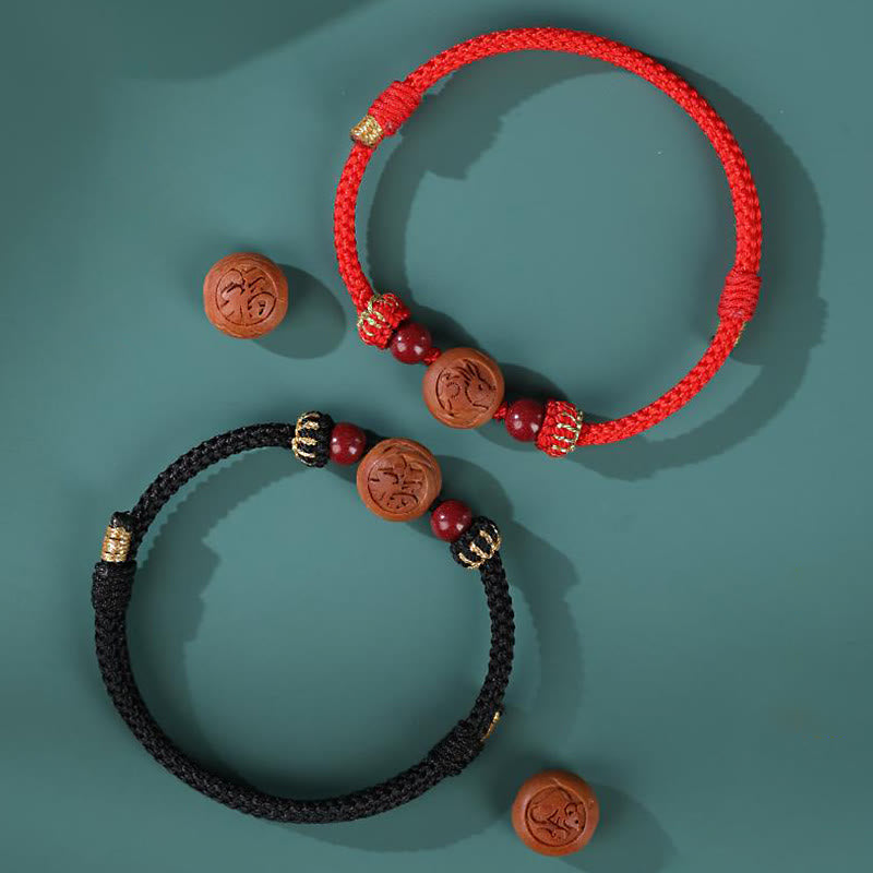 Bracelet de richesse en bois de pêcher naturel avec symbole du zodiaque chinois Fu et cinabre