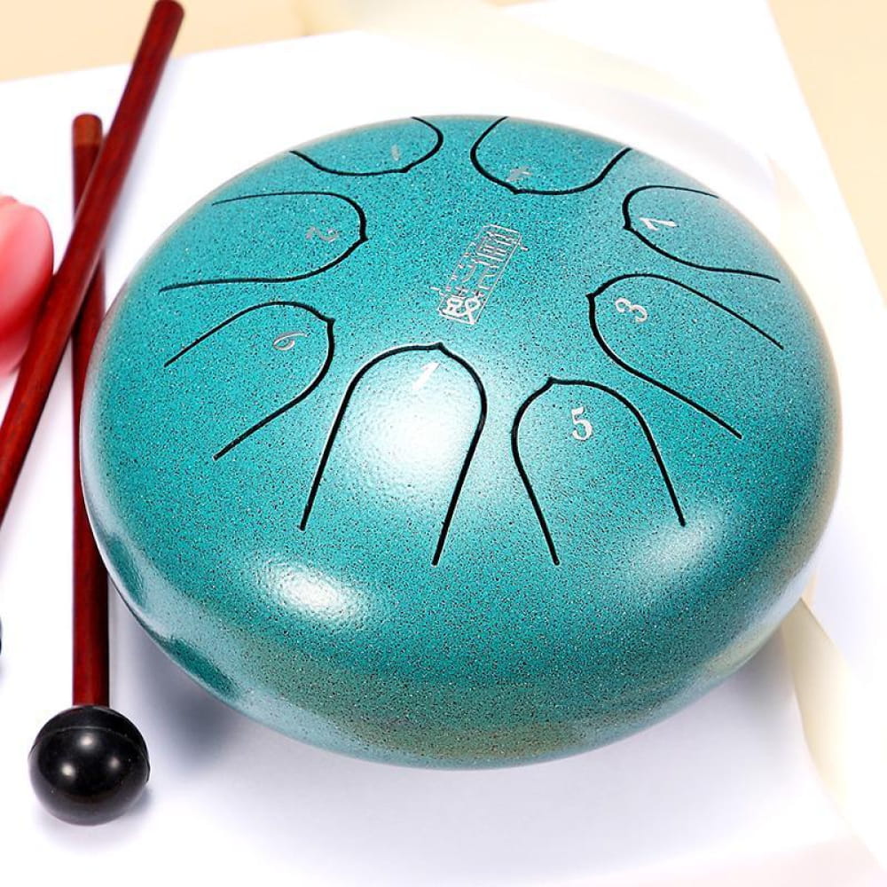 Turquoise Carbon Steel Tongue Drum with mallet and curved tone markings for kids