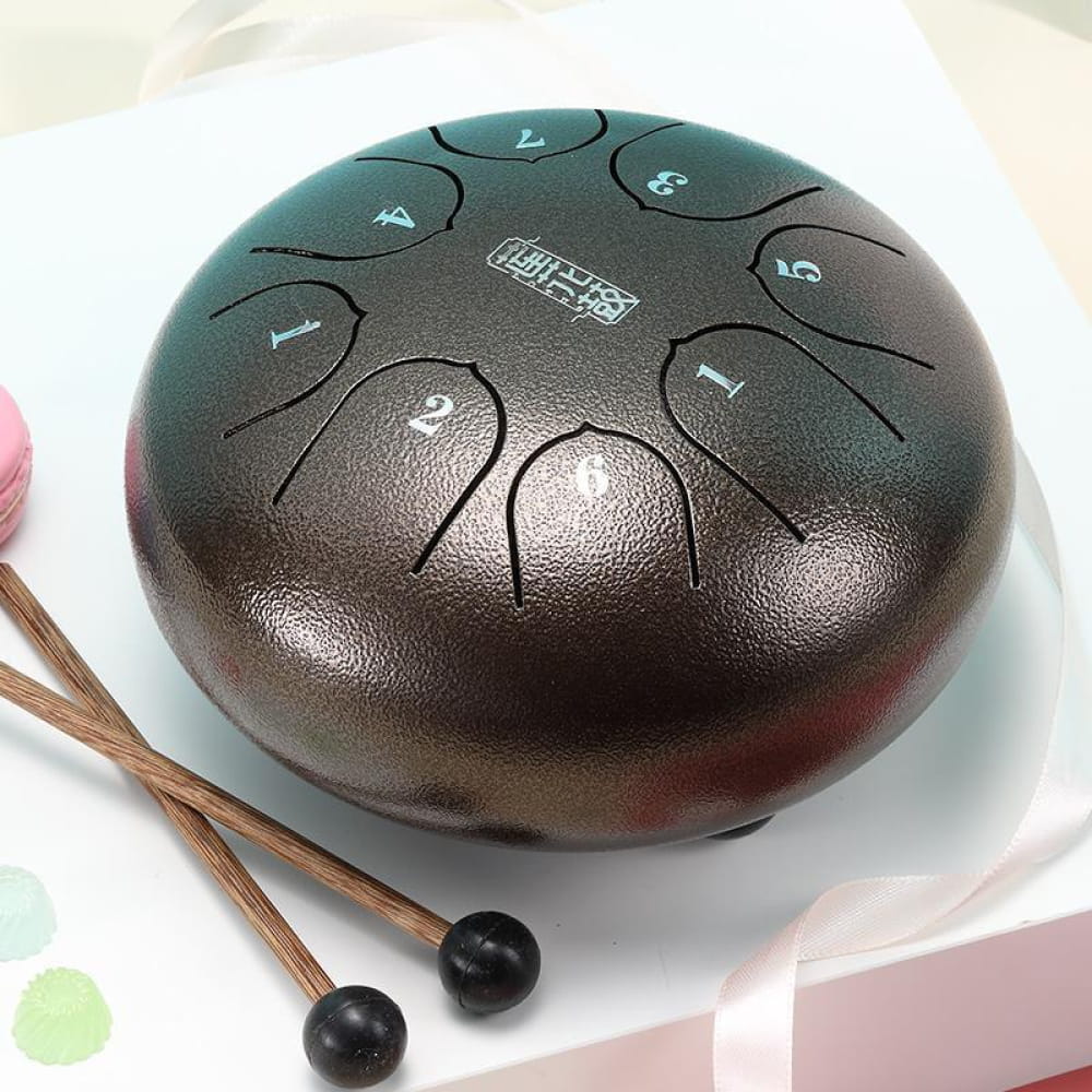 Dark-colored 6 inch Carbon Steel Tongue Drum with 8 tone zones and two mallets