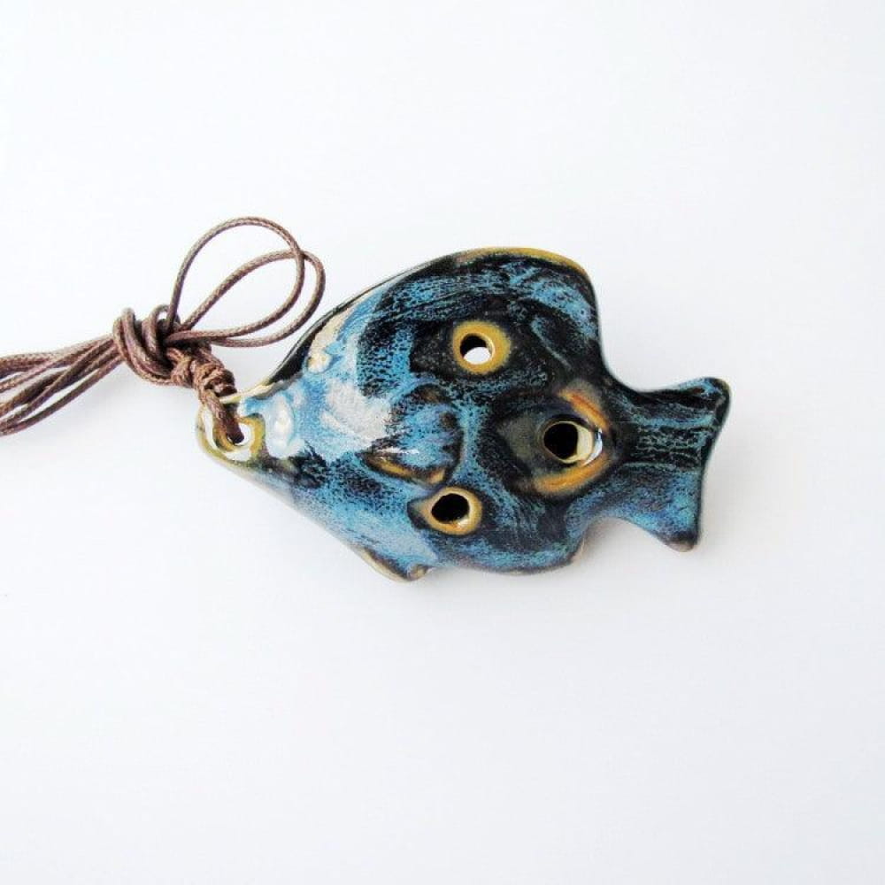 Blue ceramic fish pendant with yellow eyes on a cord for 6 Hole Alto C Ocarina