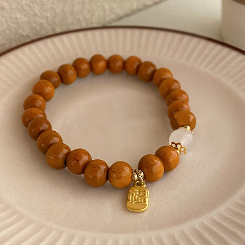Bracelet de protection à breloques Fu œil de chat en bois de santal