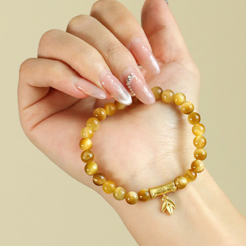 Bracelet de protection œil de tigre 6 mm avec perles symboliques lotus
