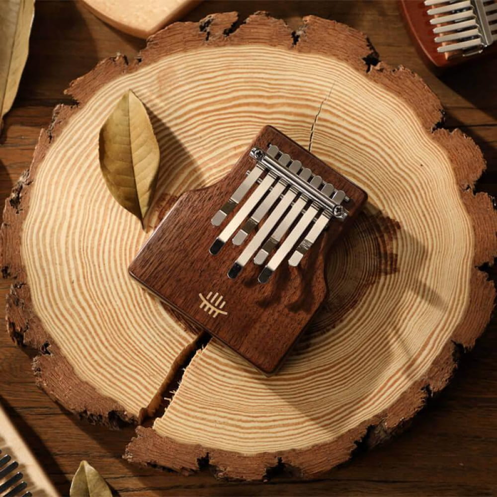 Wooden kalimba thumb piano with metal tines, 7-Key Portable Thumb Piano, Black Walnut