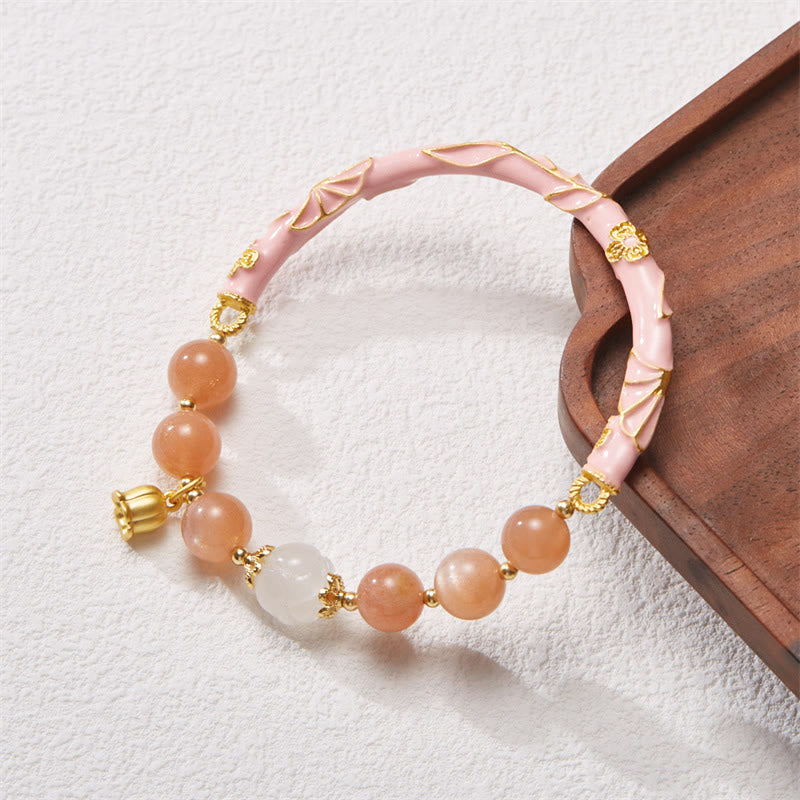 Bracelet à breloques positives en pierre de soleil et jade de soie dorée