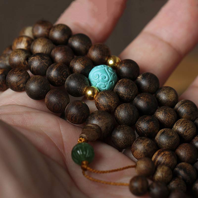 Bracelet Mala 108 perles en bois d'agar turquoise pour la méditation