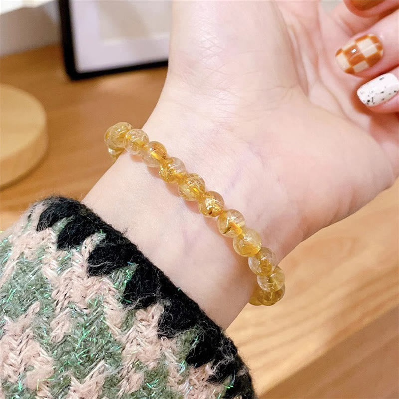Bracelet de richesse en quartz rutile doré de 7 mm avec pierre de soleil et cyanite