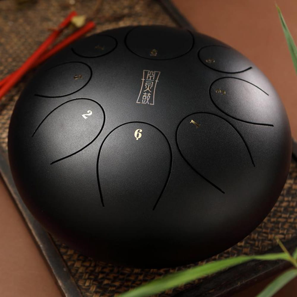 Black steel tongue drum with numbered tone zones for 8 Note F Key children’s instrument