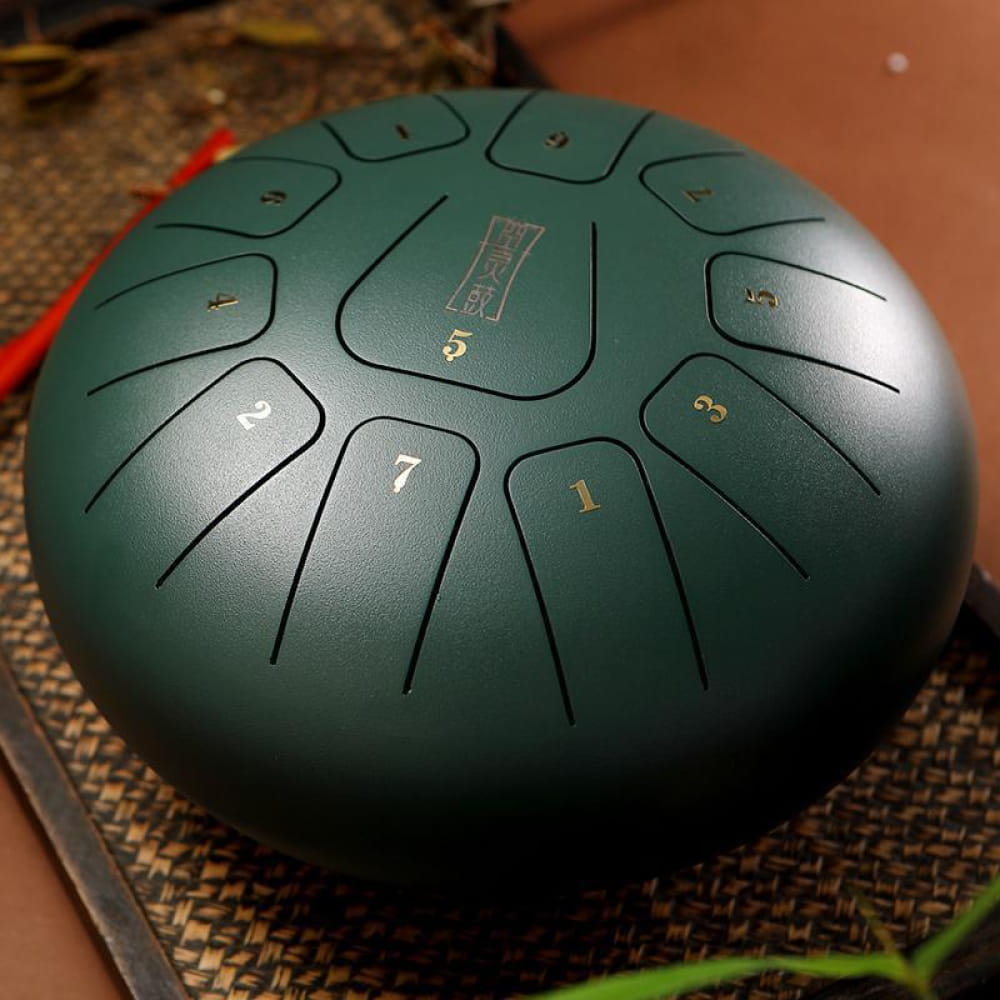 Teal steel tongue drum with numbered sections, 8-inch, 11 notes in F key