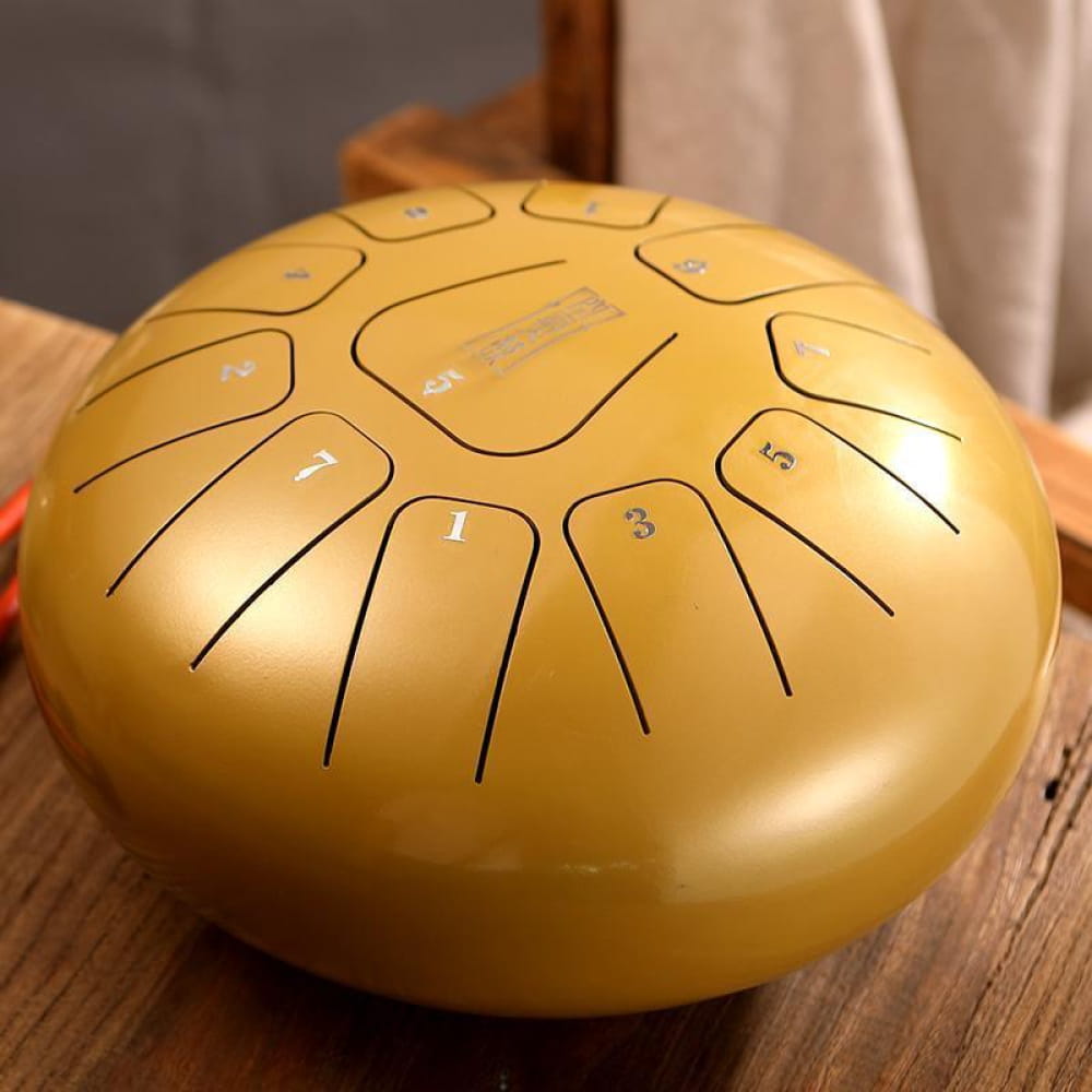Golden Steel Tongue Drum with 11 Notes in F Key and marked tone zones on surface