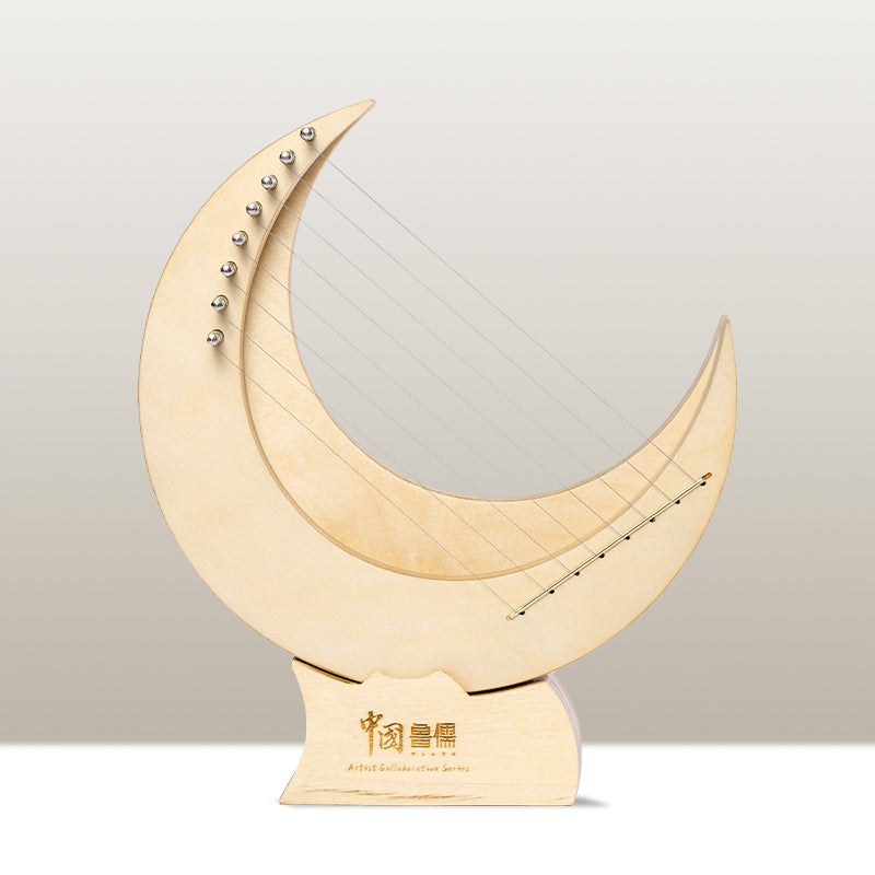 Cream-colored crescent moon sculpture with studs on 8-String Mini Lyre Harp Instrument