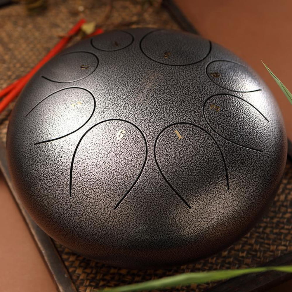 Steel tongue drum with petal-shaped tone zones, 10-inch round D key instrument
