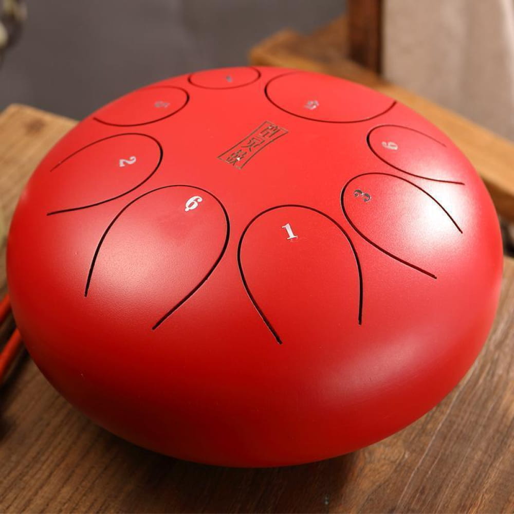 Red Steel Tongue Drum with numbered tone zones on 10 Inch D Key instrument surface