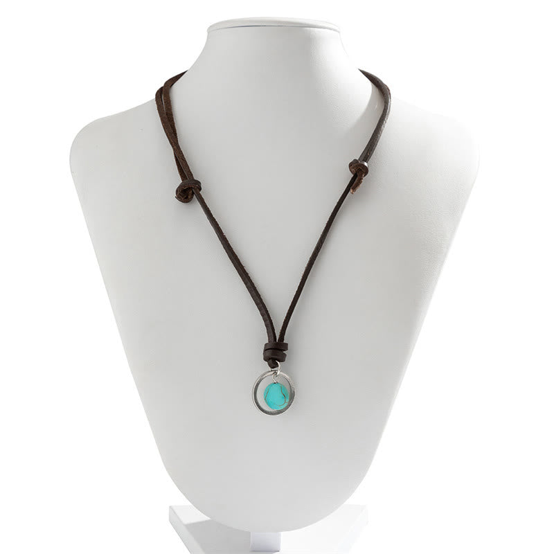 Collier pendentif rond turquoise avec symbole de force de protection