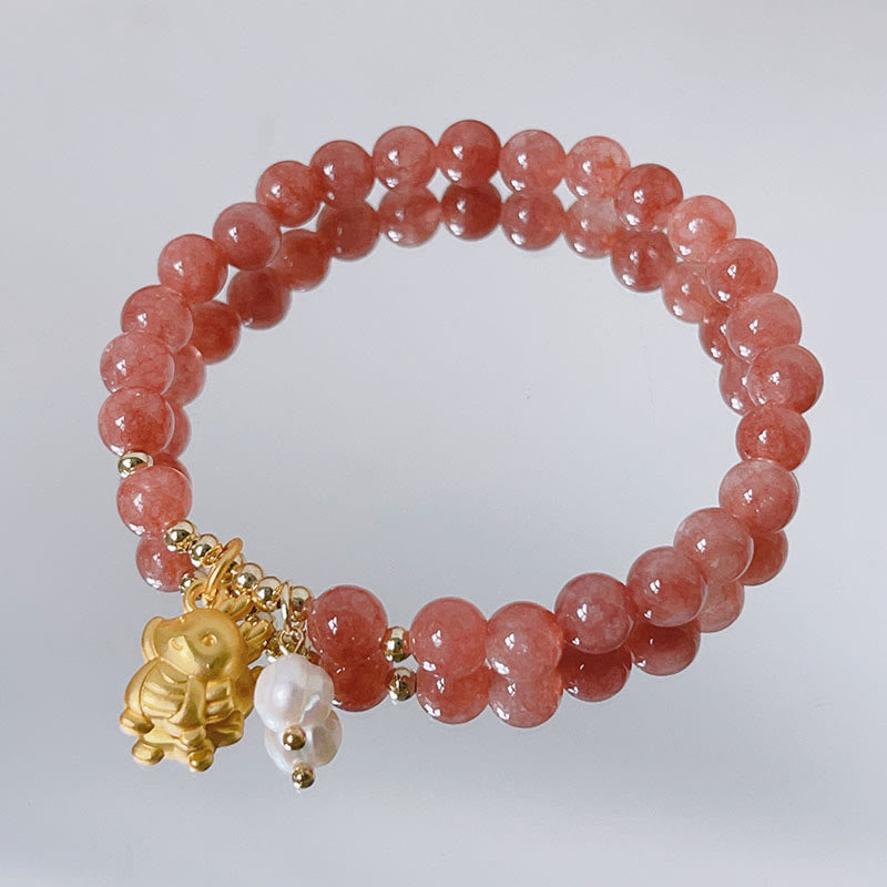 Bracelet de protection à breloques en quartz fraise et perle de dragon