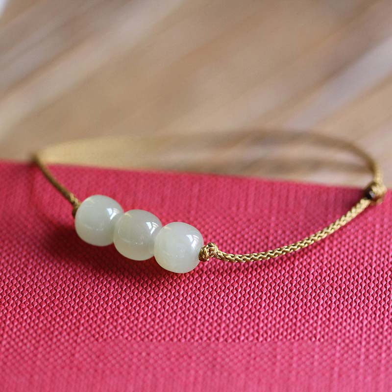 Bracelet porte-bonheur en jade à trois perles tissées