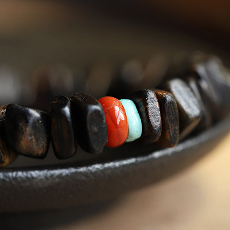 Bracelet d'équilibre en agate rouge et bois d'agar pour la méditation et la paix