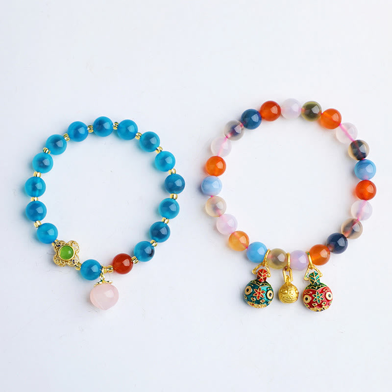 Bracelet en agate bonbon de 8 mm avec breloques dorées en forme de bête avaleuse pour l'harmonie