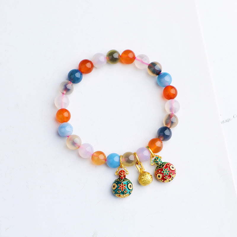 Bracelet en agate bonbon de 8 mm avec breloques dorées en forme de bête avaleuse pour l'harmonie