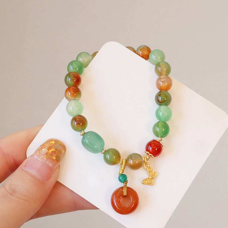 Bracelet boucle de paix en agate paon et papillon de 8 mm