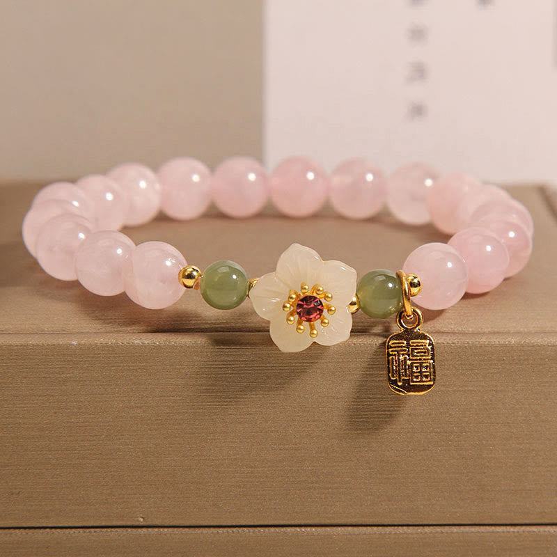 Bracelet de relation Fu en quartz rose 8 mm avec fleur de pêcher