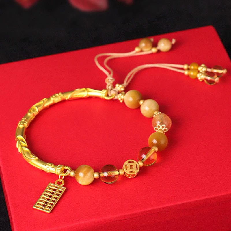 Bracelet de protection en citrine œil de tigre 8 mm avec breloque boulier
