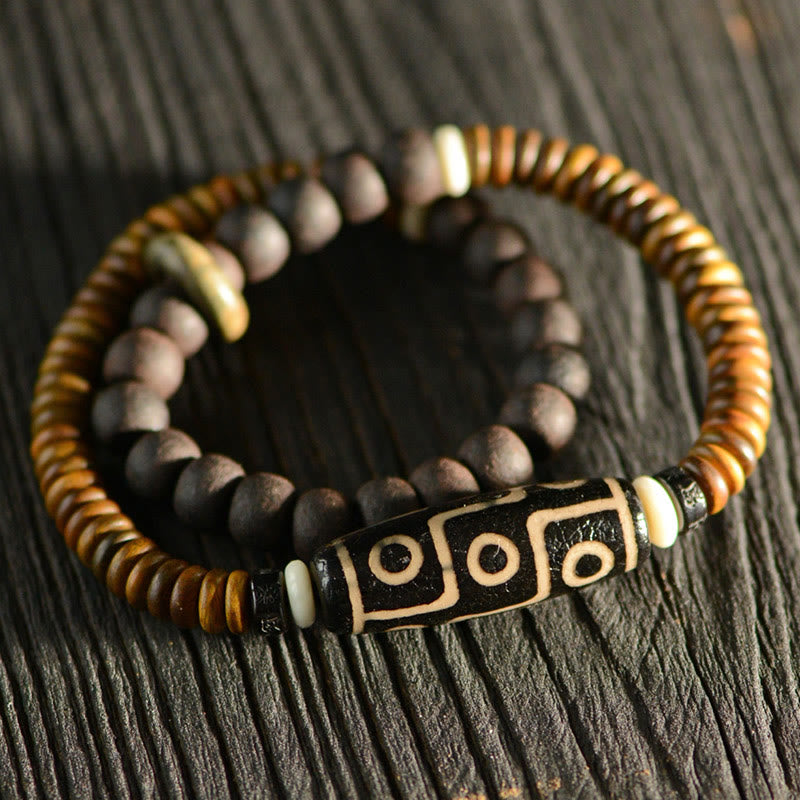 Bracelet spirituel double tour en bois d'ébène et perles Dzi à 9 œillets