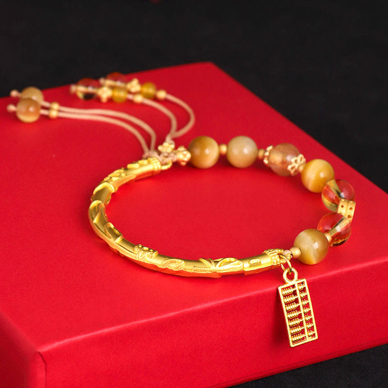 Bracelet de protection en citrine œil de tigre 8 mm avec breloque boulier