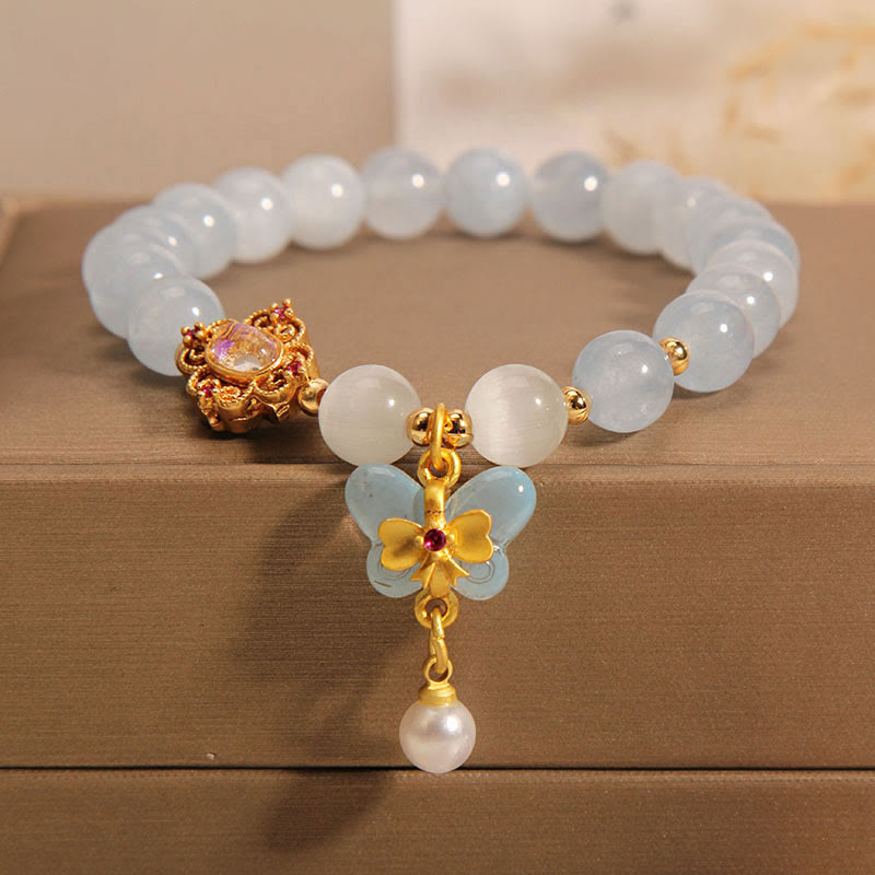 Bracelet aigue-marine avec œil de chat et perle papillon pour la guérison