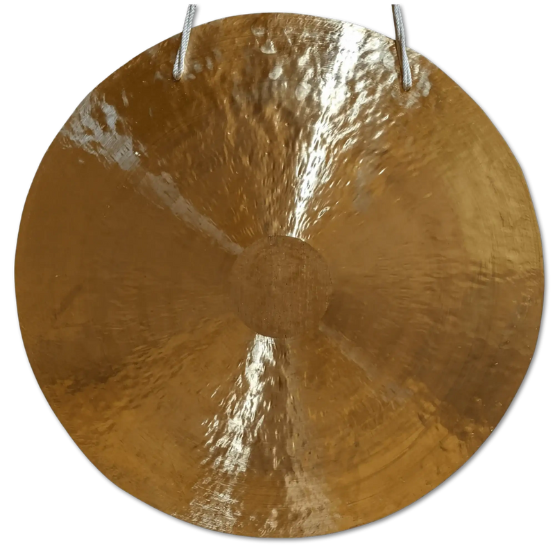 A round, golden-hued gong with a hammered texture and two white ropes for hanging.