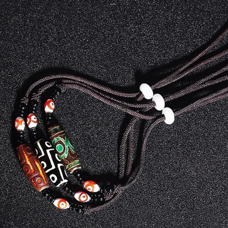 Collier unisexe en perles dzi à neuf yeux | Protection en agate