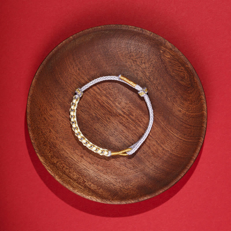 Bracelet tibétain réglable en fil d'or rouge avec nœud en fleur de pêcher