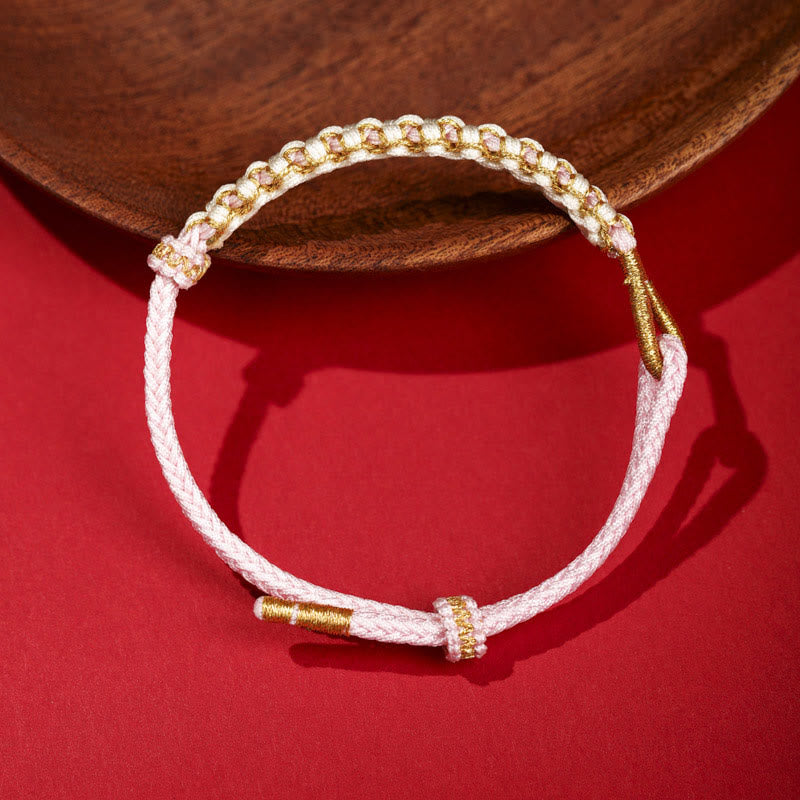 Bracelet tibétain réglable en fil d'or rouge avec nœud en fleur de pêcher