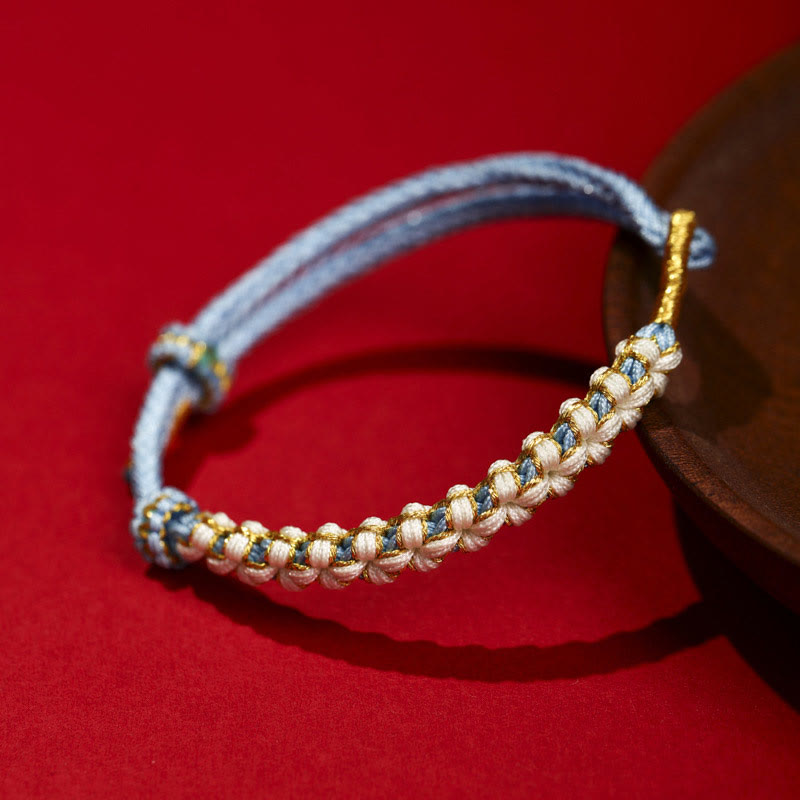 Bracelet tibétain réglable en fil d'or rouge avec nœud en fleur de pêcher