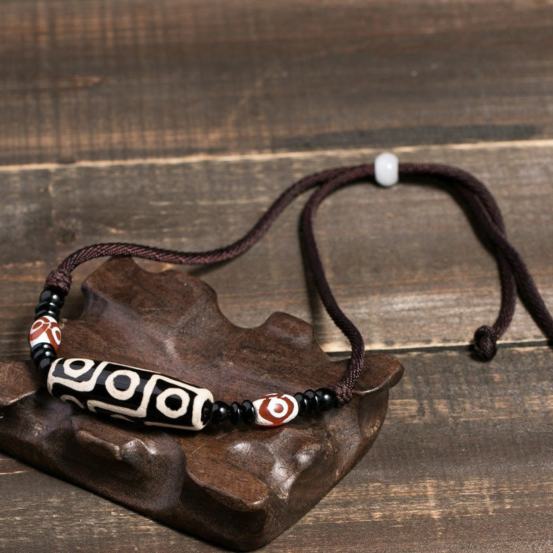 Collier unisexe en perles dzi à neuf yeux | Protection en agate