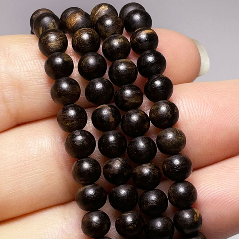 Bracelet en bois d'agar avec ambre turquoise et agate rouge pour la force