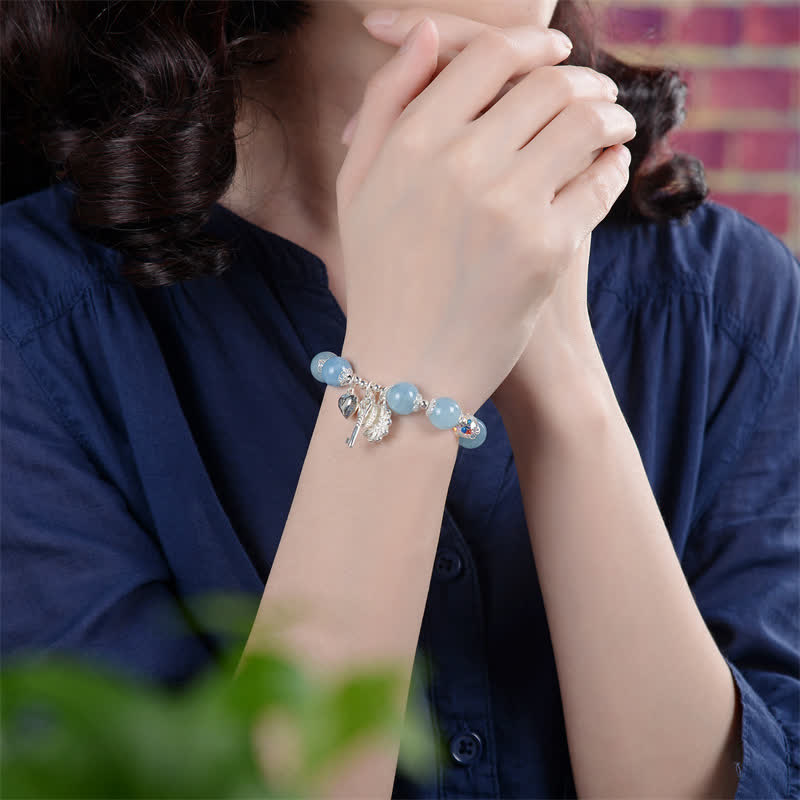 Bracelet à breloques en argent sterling et aigue-marine avec fleur de sérénité
