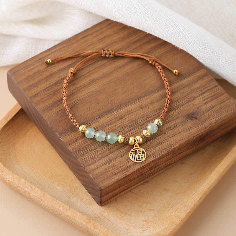 Bracelet en perles de jade avec le personnage Fu pour la prospérité et la chance