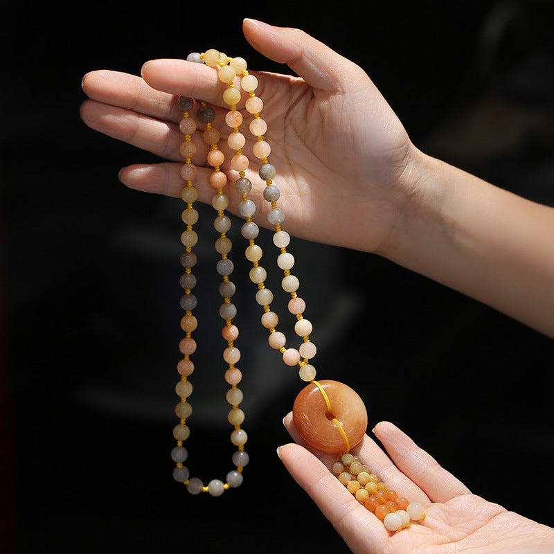 Collier pendentif en jade et soie dorée | Porte-bonheur