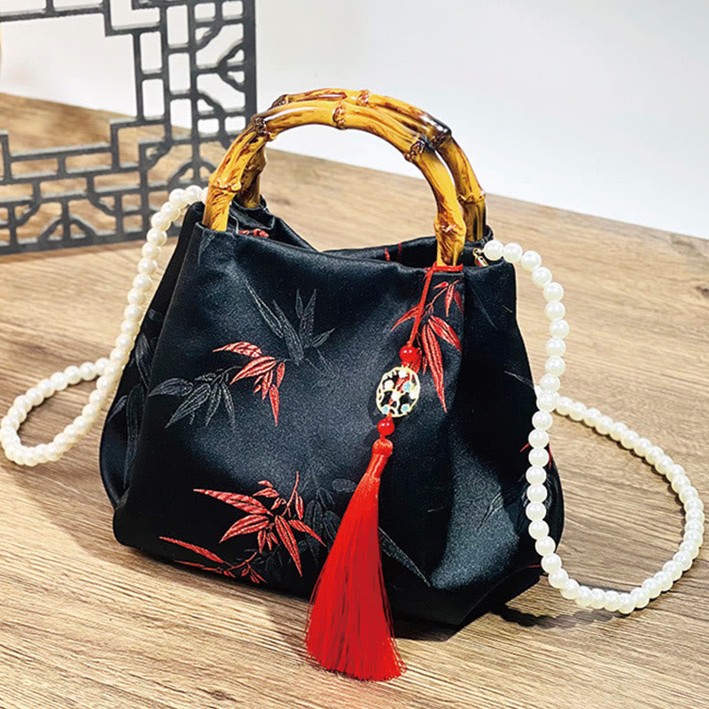 Sac en polyester et coton noir brodé de feuilles avec poignée en bambou