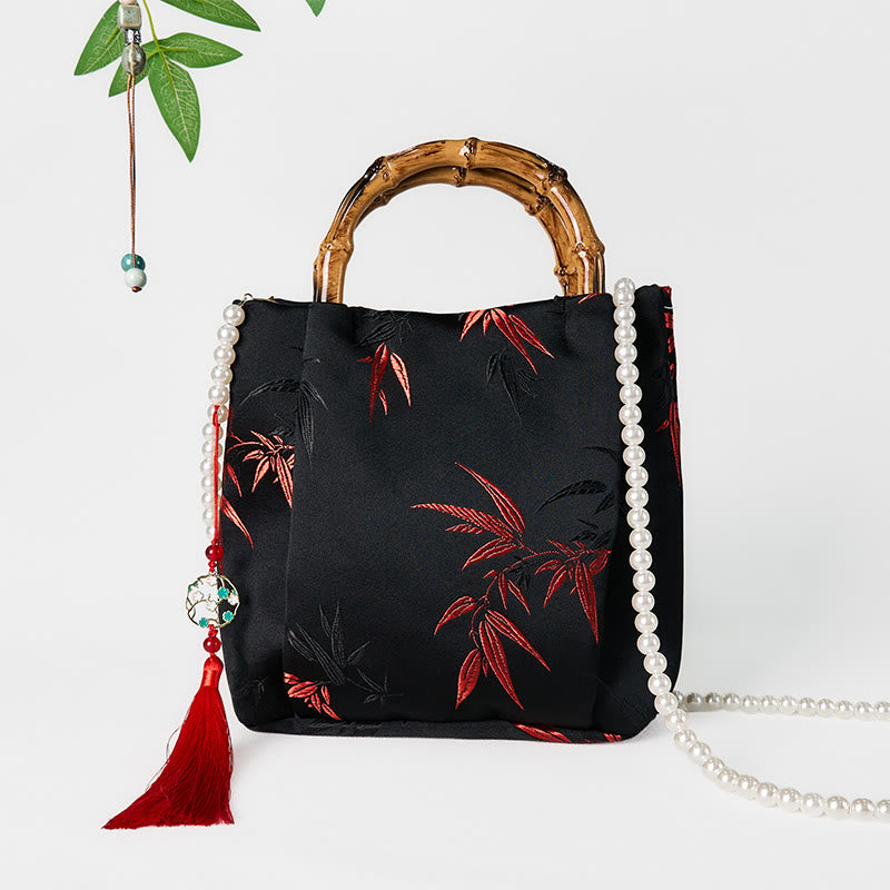Sac en polyester et coton noir brodé de feuilles avec poignée en bambou