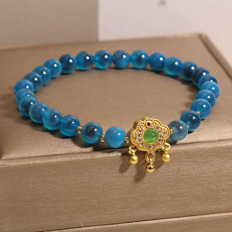 Bracelet en agate bleue avec breloque cadenas chinois pour la protection